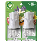 Packaged pair of white Air Wick plug-in oil warmers on green retail blister card with fruit and flowers