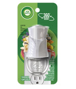 Retail blister pack of a white Air Wick plug-in scented oil warmer visible in clear plastic on green backing