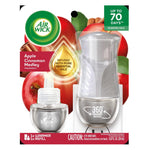 Air Wick plug-in warmer and refill visible in blister pack with apple and cinnamon background and scent callouts.