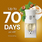 Air Wick plug‑in warmer shown with a refill and text proclaiming up to 70 days per refill alongside hazelnut and whipped topping imagery