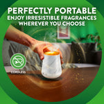 Lifestyle-style image of a hand placing a cordless marble-look diffuser on a table with headline perfectly portable