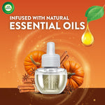 Air Wick closeup of a pumpkin spice refill bottle with pumpkins, cinnamon and a droplet graphic promoting natural essential oils