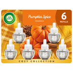 Air Wick Pumpkin Spice refill pack artwork showing six plug-in oil refill bottles over pumpkins and cinnamon background