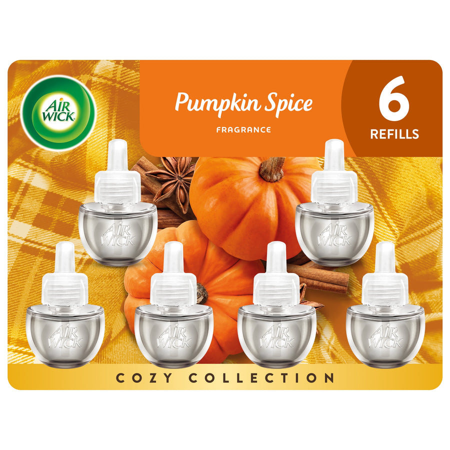Air Wick Pumpkin Spice refill pack artwork showing six plug-in oil refill bottles over pumpkins and cinnamon background
