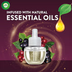 Single Air Wick refill bottle over a swirl background with cranberries and a droplet graphic reading infused with natural essential oils