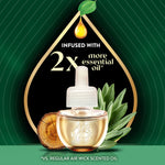 Air Wick scented oil refill bottle with drop graphic and text claiming infused with 2x more essential oil on dark green background