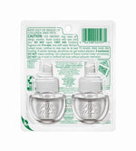 Clear blister-back view of two Air Wick plug-in scented oil refill bottles with product caution text and barcode on backing card