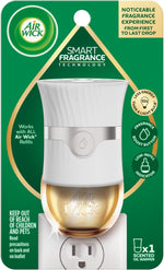 Retail card packaging showing Air Wick logo and white advanced plug-in oil warmer with icons for fragrance boost and low-refill indicator