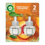 Air Wick Sweet Peach & Sunshine refill twin-pack blister card showing two clear plug-in oil refills over peach background