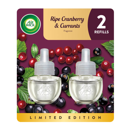 Air Wick branded blister pack artwork showing two plug-in oil refill bottles against cranberry and currant background