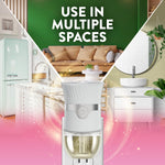 Air Wick plug-in warmer overlaid on collage of home spaces with text 'Use in multiple spaces' promoting versatility