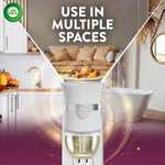 Air Wick plug-in warmer pictured with background scenes of kitchen, living room and bathroom and text 'Use in multiple spaces'