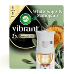 Air Wick Vibrant plug-in warmer and refill shown on branded green White Sage & Mahogany packaging with wood and sage visuals