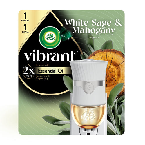 Air Wick Vibrant plug-in warmer and refill shown on branded green White Sage & Mahogany packaging with wood and sage visuals