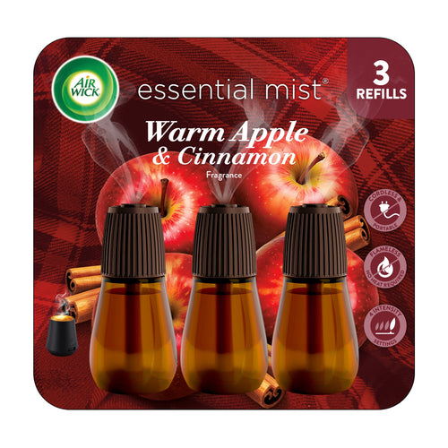 Three amber scent refill bottles with brown caps on a red apple and cinnamon background, Air Wick Essential Mist packaging