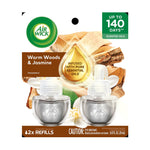 Air Wick Warm Woods & Jasmine 2-pack refill blister card showing two clear oil refill bottles and branding.