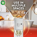 Air Wick plug-in warmer overlaid on lifestyle vignettes and text stating use in multiple spaces with autumn decor.