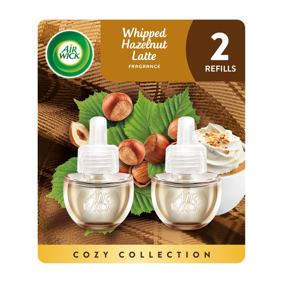 Air Wick cozy collection blister pack showing two Whipped Hazelnut Latte plug‑in refill bottles with hazelnuts and whipped topping artwork
