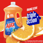Ajax Ultra orange dish soap bottle on red background with sliced oranges and ‘triple action’ text