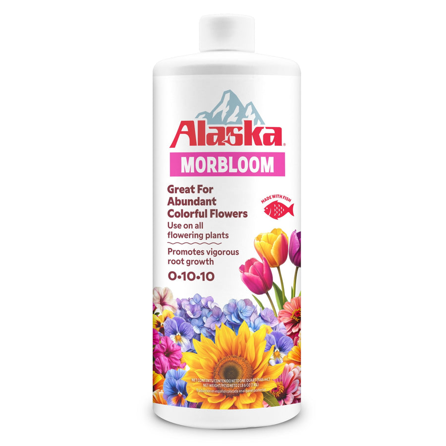 Isolated white bottle of Alaska Morbloom plant food with colorful floral label on a white background