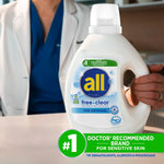 Close-up of all® free clear detergent bottle held by a person in medical attire with recommendation badge