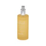 Tall frosted yellow Allswell 'refresh' room and linen spray bottle with silver atomizer on white background