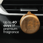 Close view of amber marbled Scent Theory vent diffuser clipped to a car vent with text claiming up to 40 days
