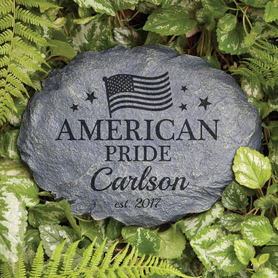 Decorative garden stone engraved with an American flag, the words "AMERICAN PRIDE" and personalized name "Carlson" with est. date.