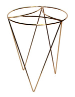 Angled view of a Mainstays gold metal plant stand with crisscross legs