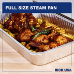 Close angled view of a full-size aluminum steam pan filled with roasted chicken and fries on a wood surface, RICK USA header visible