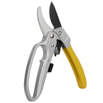 Angled view of ratcheting pruners with silver frame, black blade and yellow ergonomic handle on white