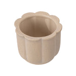 Angled top view of a tan scalloped ceramic planter showing glossy interior and textured outer surface.