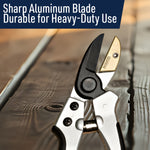 Close-up angled view of anvil pruning shears blade and anvil plate on a textured wooden surface with promotional headline
