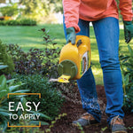 Person applying Preen Extended Control granules from a yellow jug along a garden border with overlay text 'EASY TO APPLY'.