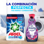 Ariel Ultra Oxi powder pack displayed next to a purple Downy Intense fabric softener bottle on a wooden surface.