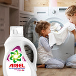 Ariel Ultra Concentrado detergent bottle in a laundry room scene with a child and adult smelling a white towel by a front-load washer.