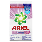 Tall Ariel powder detergent bag with green swirl logo, Downy branding and pink radiating background.