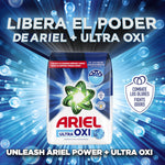 Advertising graphic showing an Ariel Ultra Oxi powder pack centered among blue bubbles with headline 'Libera el poder'.