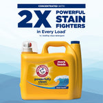 Yellow Arm & Hammer detergent jug below bold text claiming '2X powerful stain fighters' on a blue background