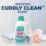 Arm & Hammer Baby detergent bottle displayed with soft folded linens and a plush bear under the headline about cuddly clean scent.