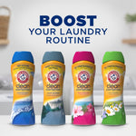Promotional scene showing four Arm & Hammer Clean Scentsations scent booster bottles with headline "BOOST YOUR LAUNDRY ROUTINE"