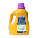 Rear view of yellow detergent bottle showing directions, warnings and a small sustainability icon panel on a white background
