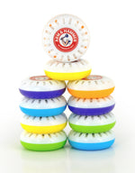 Pyramid stack of multicolored Arm & Hammer vented freshener discs with one disc upright showing logo