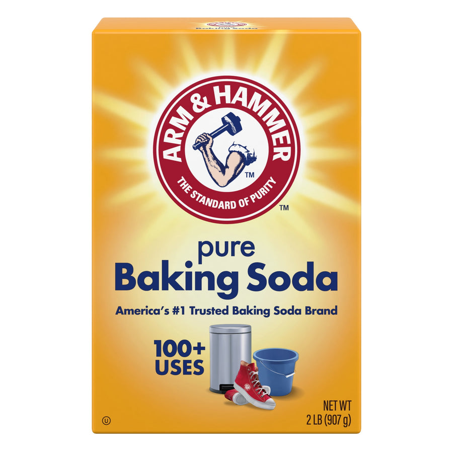 Front-facing Arm & Hammer pure Baking Soda box with sunburst logo, product name and small icons on yellow background.