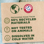 Recycled cardboard-style panel showing Arm & Hammer logo and claims about 50% recycled packaging and not tested on animals