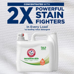 Arm & Hammer Sensitive Skin detergent jug against textured background with large '2X Powerful Stain Fighters' headline above.