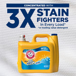 Yellow detergent jug with pump and blue cap under large text stating concentrated with 3X stain fighters on textured background