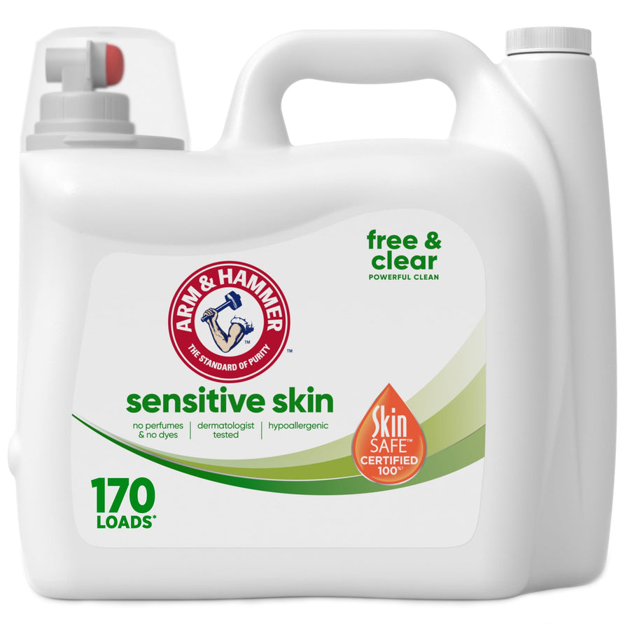 White Arm & Hammer Sensitive Skin liquid laundry detergent jug with handle and SkinSAFE certified seal on front label.