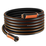Coiled black and orange garden hose with brass connectors and textured orange grip, shown in a neat stacked loop.
