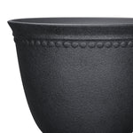 Close-up crop of the upper half of a black textured planter showing beaded rim detail